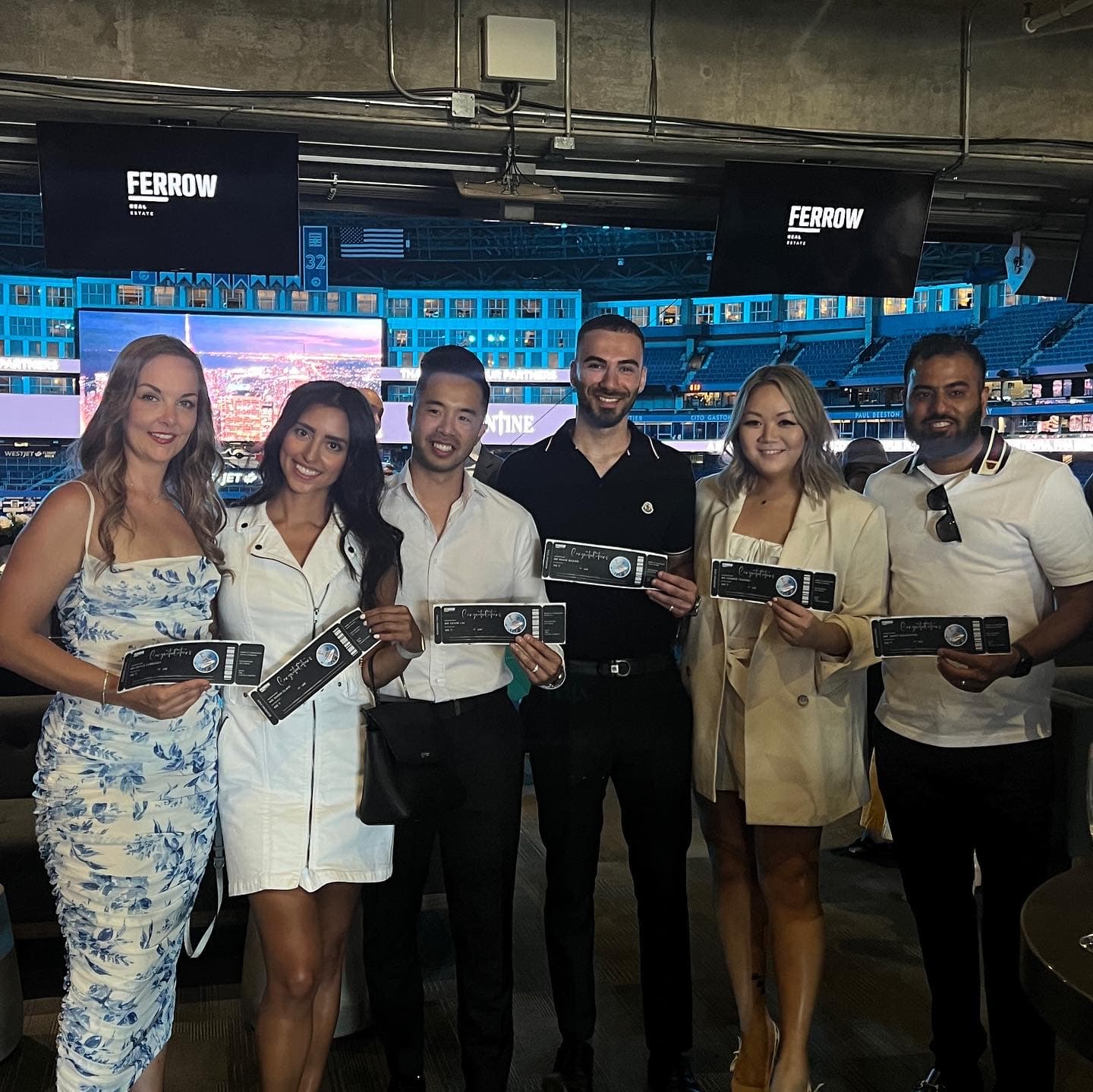 Ferrow Real Estate team at a stadium celebration event