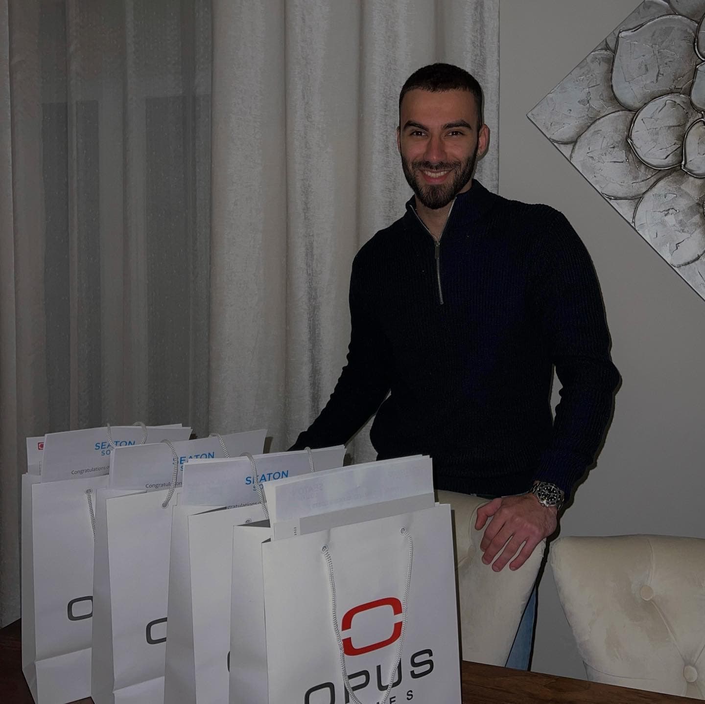 Navid Rashid with Opus Homes Seaton closing gift bags