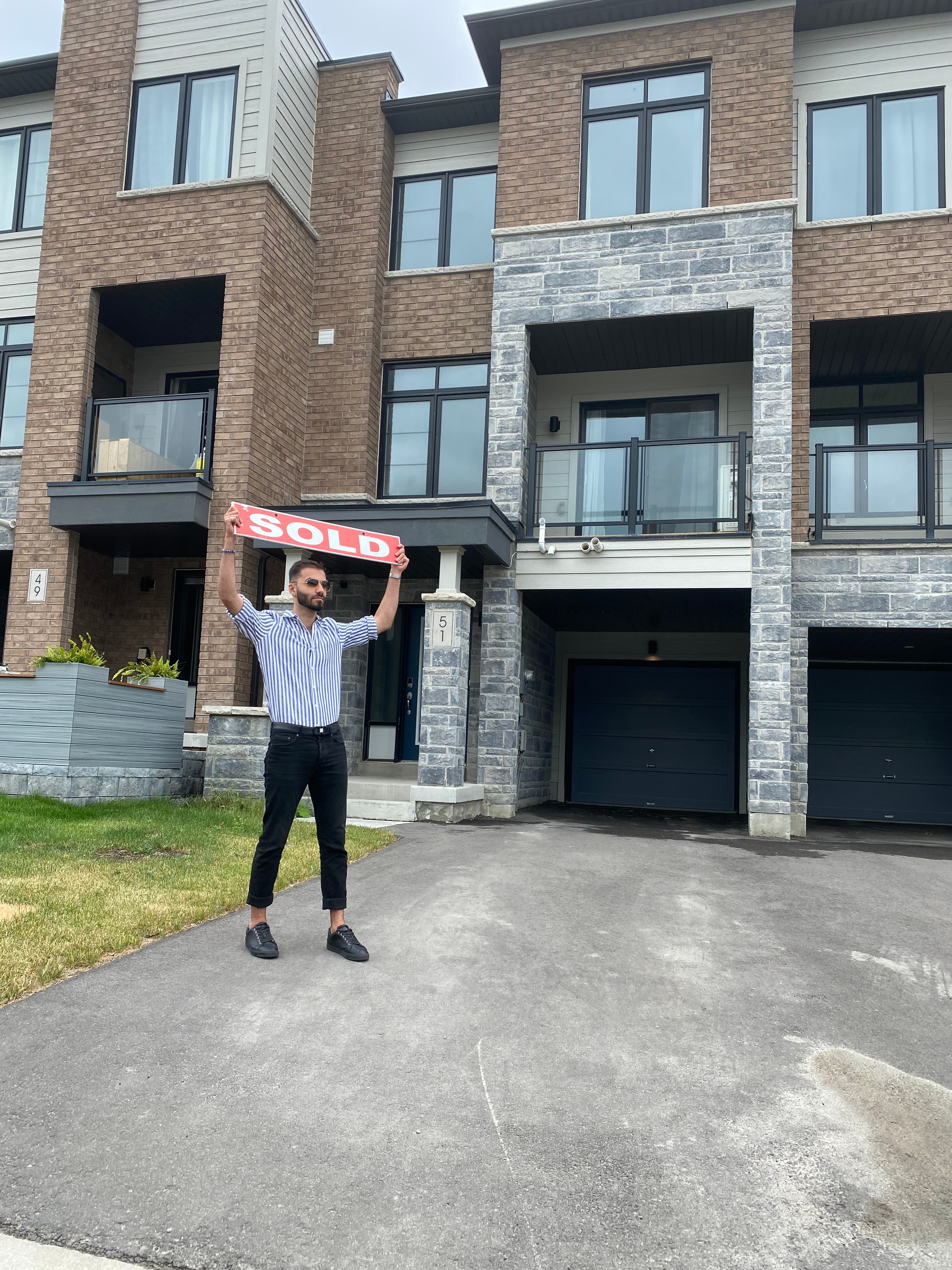 Sold townhouse closing with a red sold sign