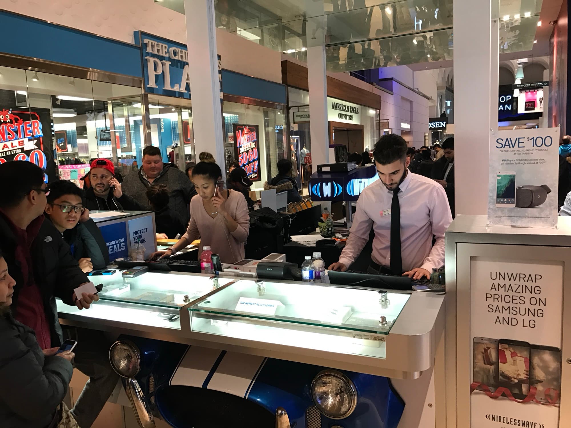 A young Navid Rashid selling phones at a Glentel mall kiosk